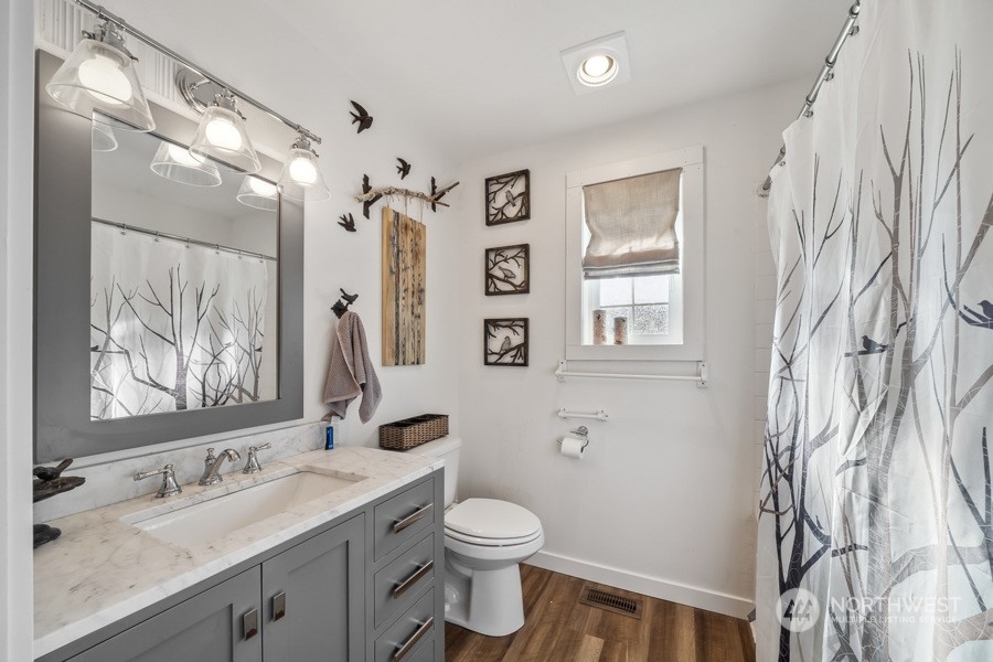 2007 Park Enumclaw Wa 98022 Enumclaw, WA 98022 - Photo 17 of 34 a bathroom with a granite countertop sink toilet and painting on the wall