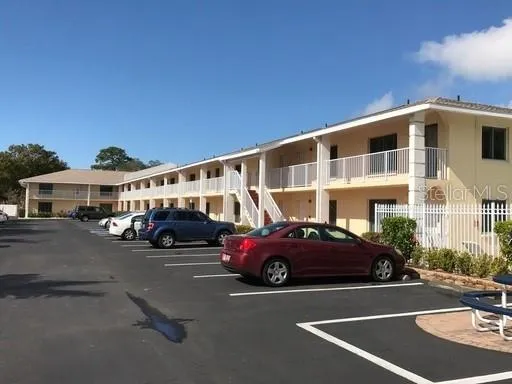 a front view of a house with parking space