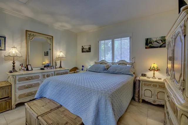 a bed room with a bed and a mirror