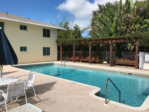 a view of a house with backyard and porch