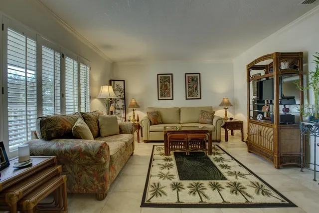 a living room with furniture and a rug