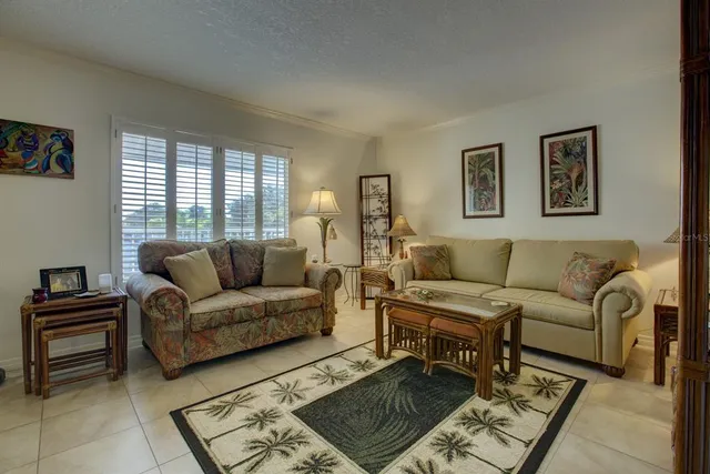 a living room with a couch and a window