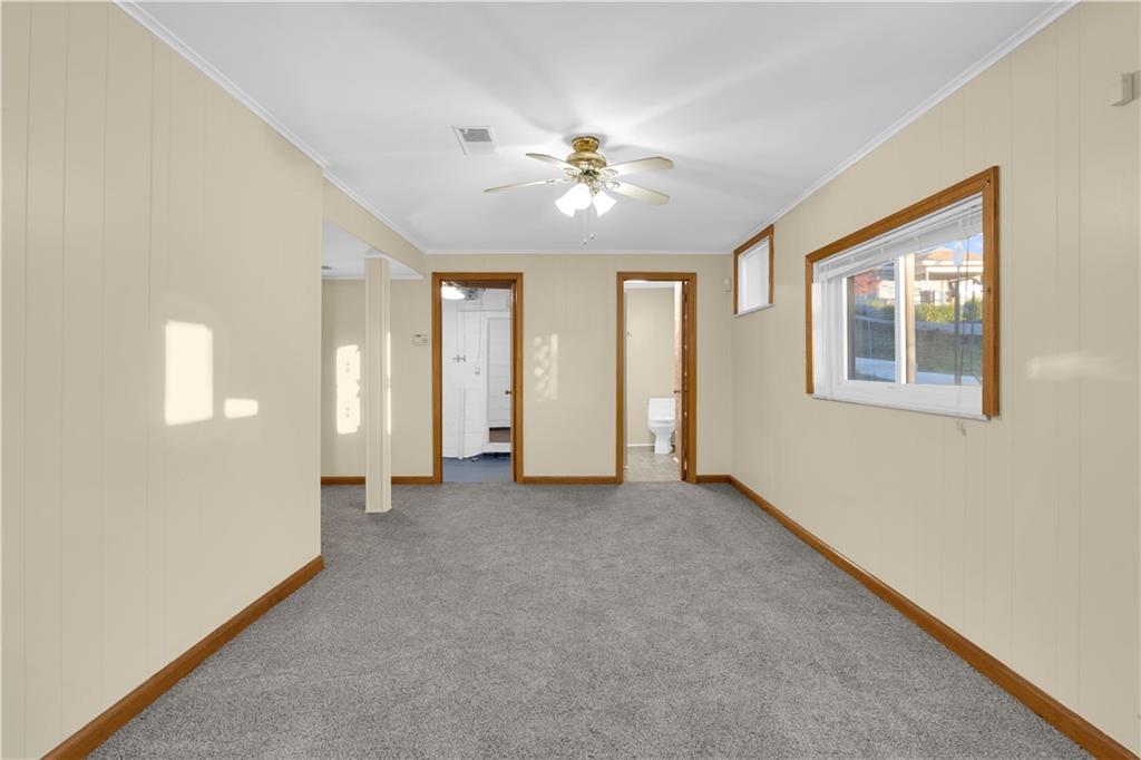 2071 Brodhead Road Aliquippa, PA 15001 - Photo 20 of 30 an empty room with chandelier fan and windows