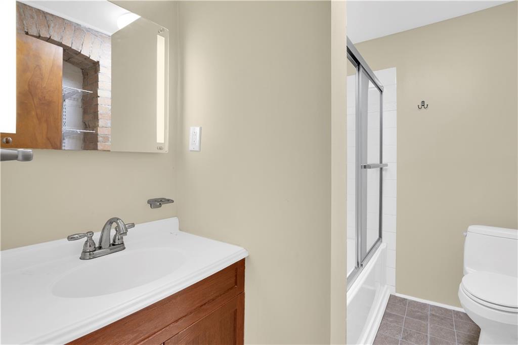 2071 Brodhead Road Aliquippa, PA 15001 - Photo 21 of 30 a bathroom with a sink toilet and a mirror