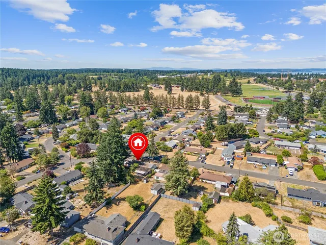 an aerial view of residential building and lake