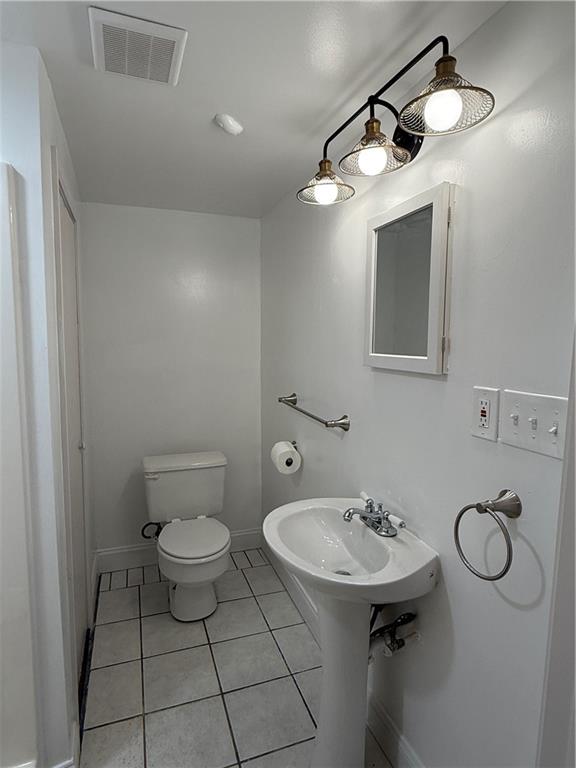 456 Poverty Road, Unit B Murrayville, GA 30564 - Photo 14 of 21 a bathroom with a sink toilet and a mirror