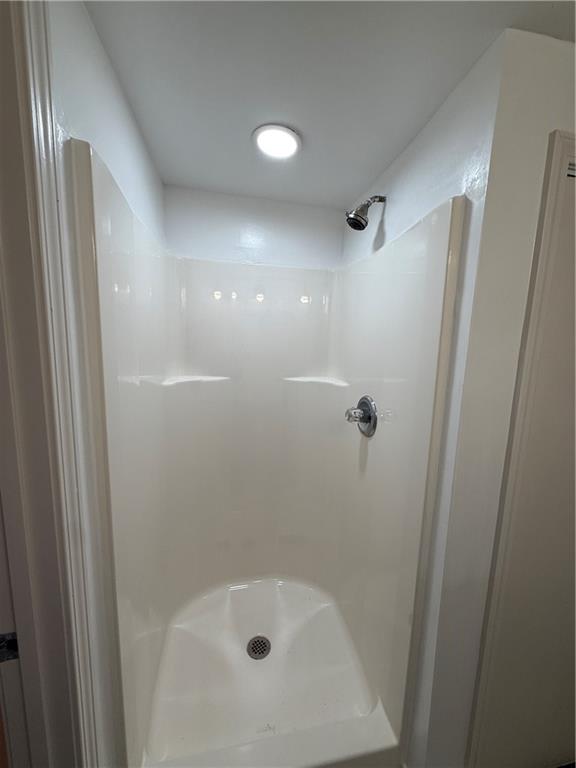 456 Poverty Road, Unit B Murrayville, GA 30564 - Photo 15 of 21 a bathroom with a shower and tub