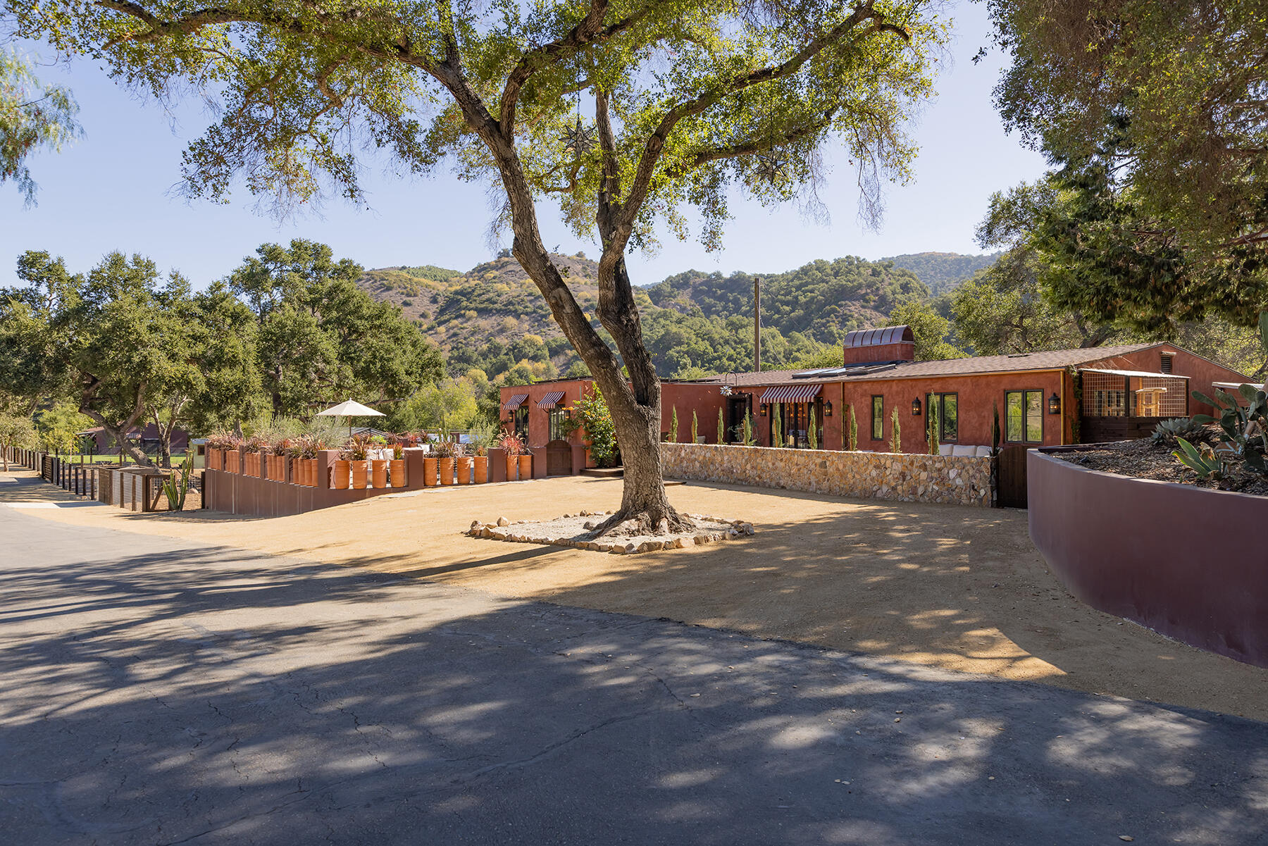 a view of a house with a tree in the background
