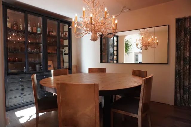 a dining room with furniture and window