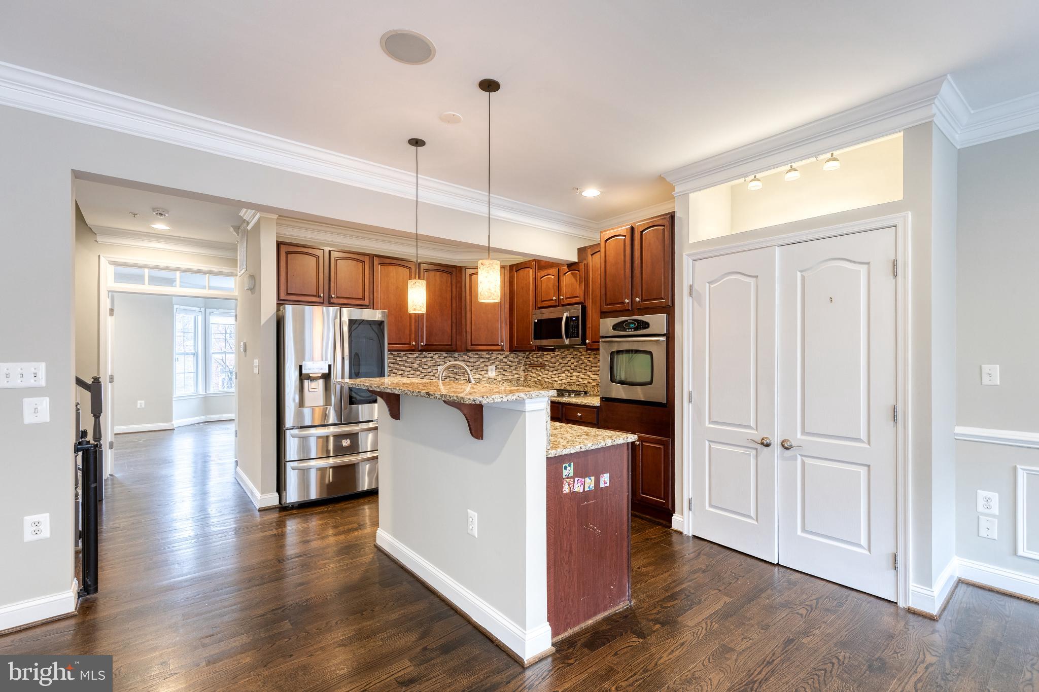 3307 Fait Avenue Baltimore, MD 21224 - Photo 11 of 26 a kitchen with refrigerator and wooden floor