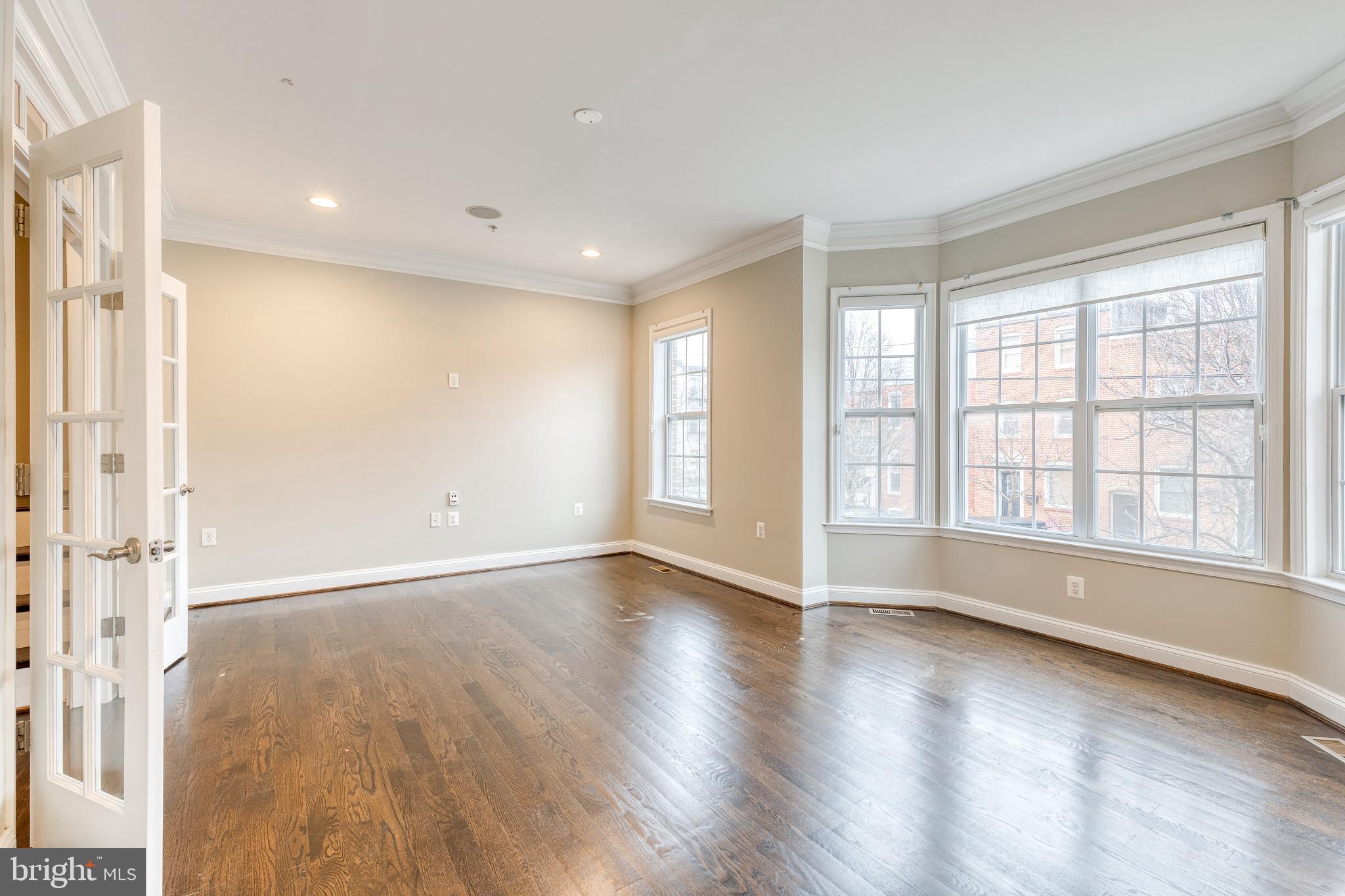 3307 Fait Avenue Baltimore, MD 21224 - Photo 15 of 26 wooden floor in an empty room with a window