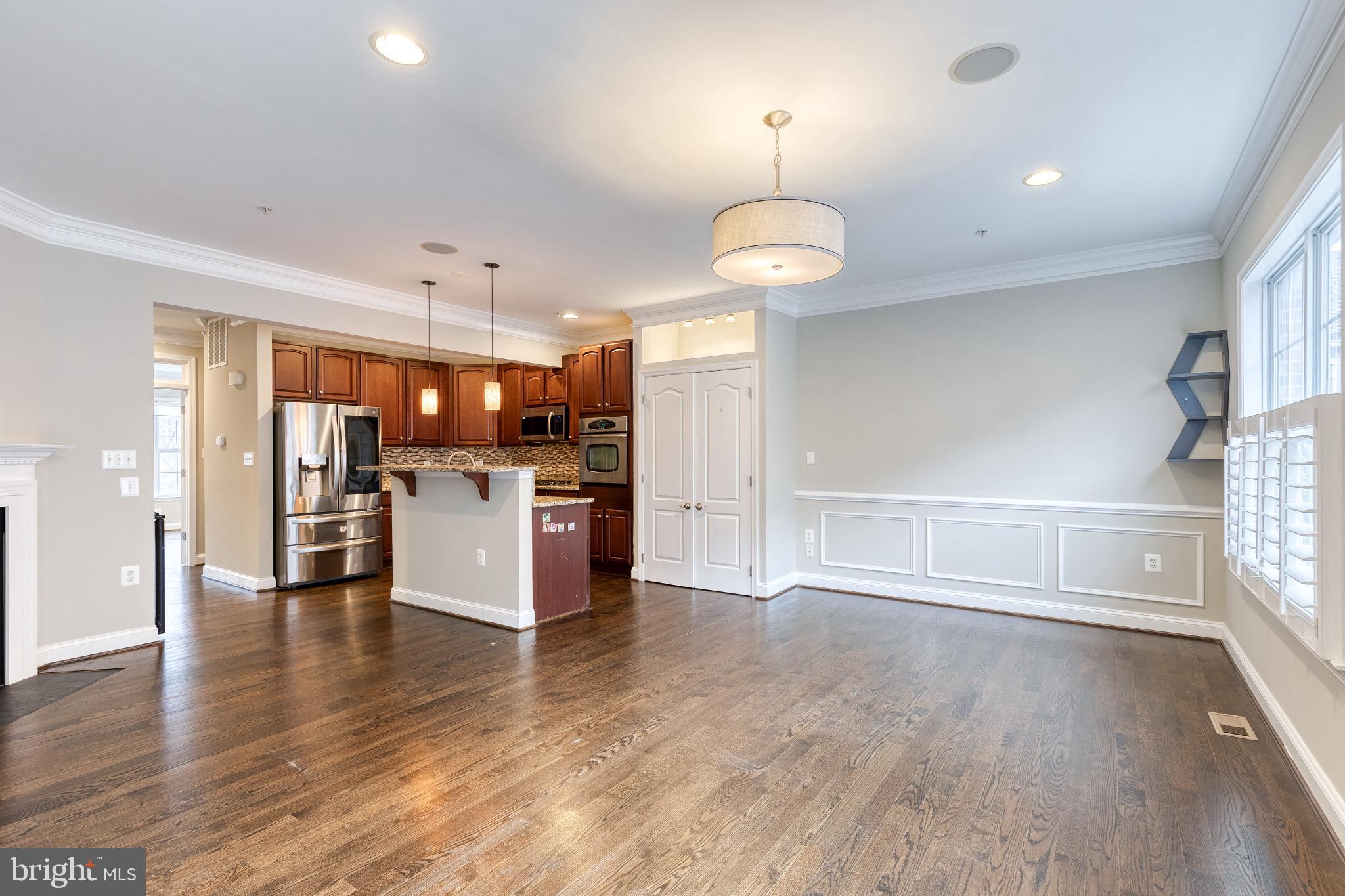 3307 Fait Avenue Baltimore, MD 21224 - Photo 8 of 26 a view of a kitchen with a stove cabinets and wooden floor
