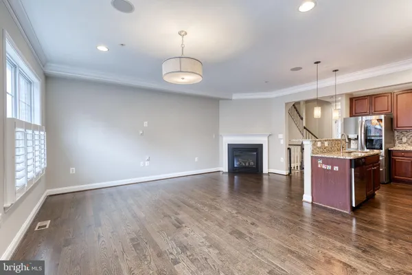 a view of kitchen and dining room with wooden floor