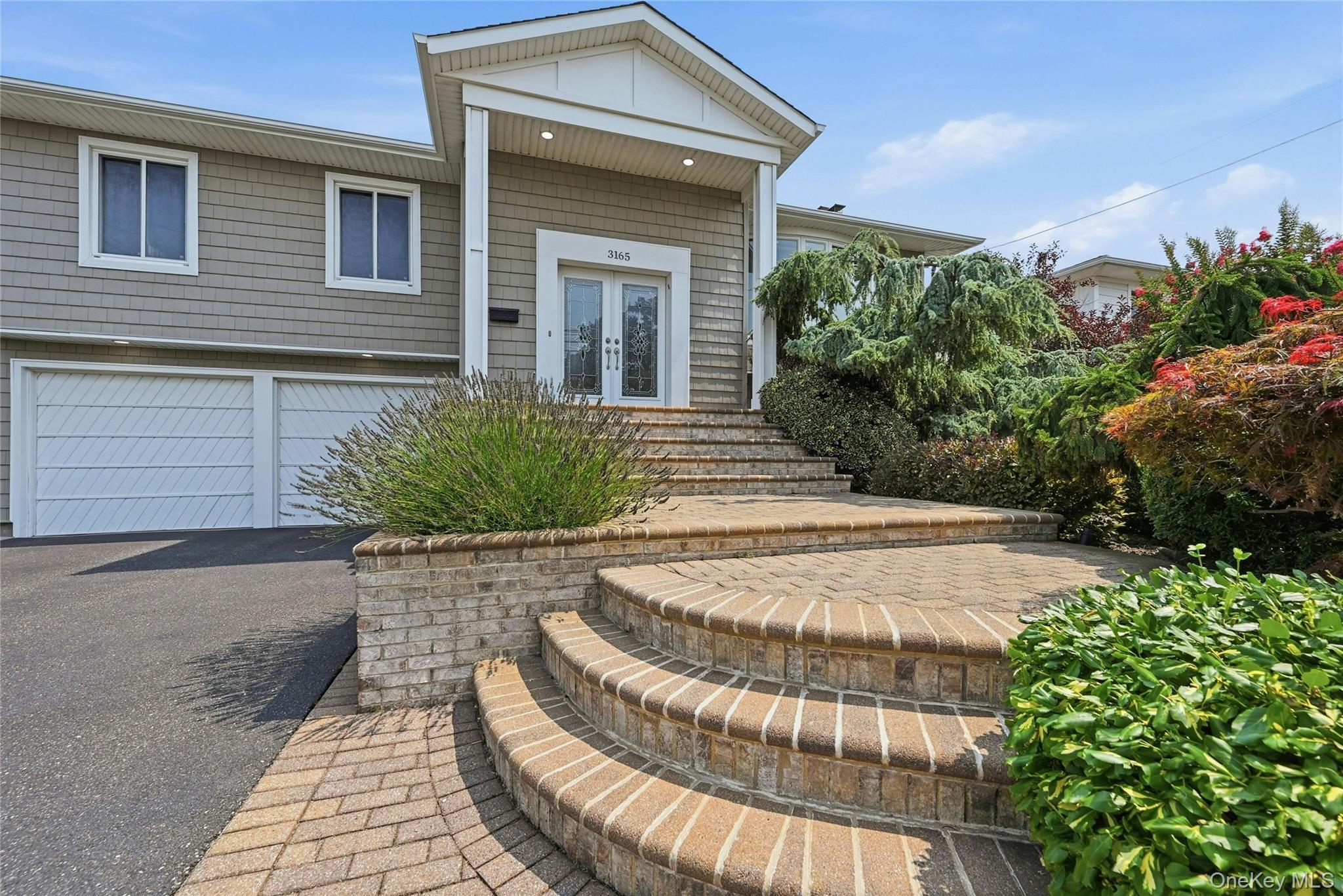 Paver stairs leading to front entry of home
