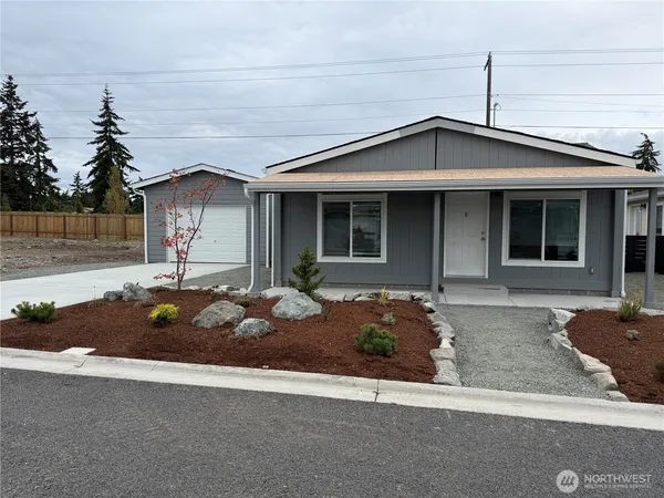 a front view of a house with garage