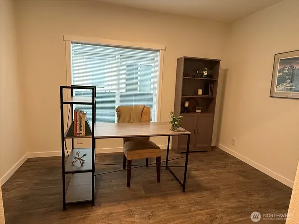 a view of a workspace with furniture