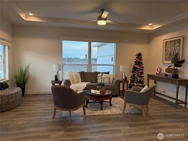 a living room with furniture and a potted plant