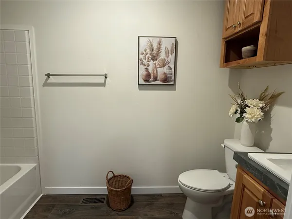 a bathroom with a toilet and a sink