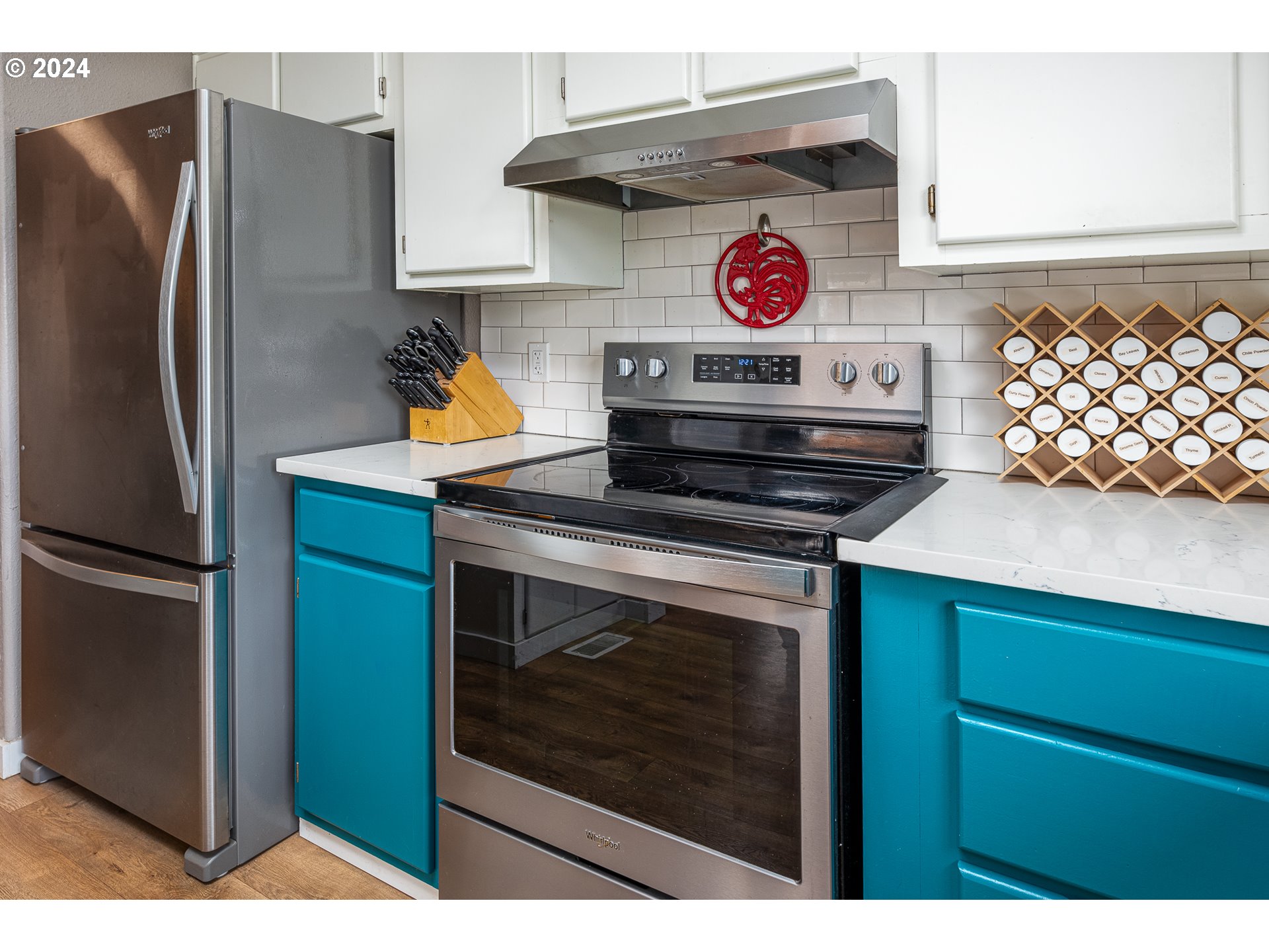 434 39th Street Springfield, OR 97478 - Photo 13 of 28 a kitchen with stainless steel appliances granite countertop a stove and a refrigerator