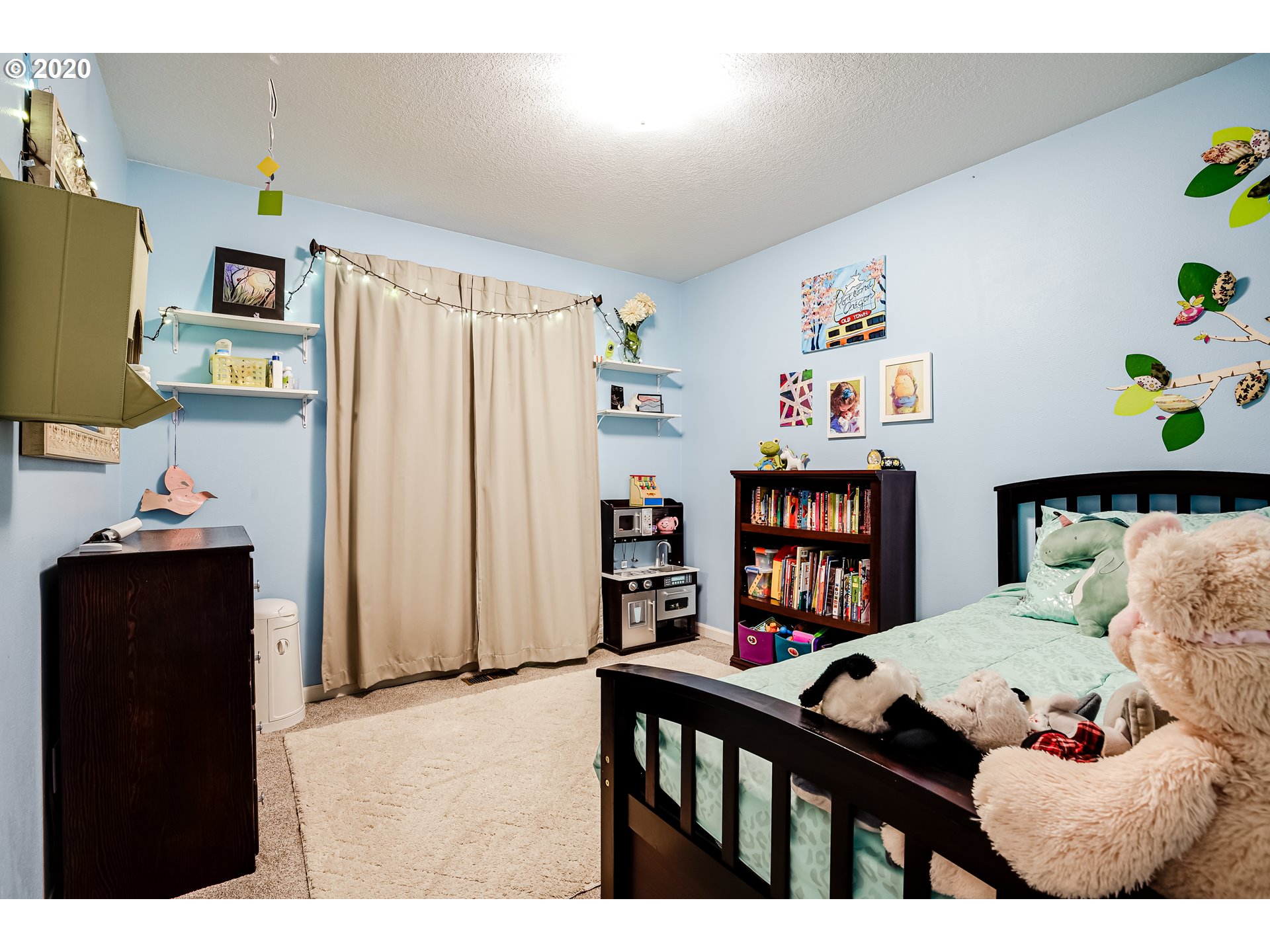 591 68th Place Springfield, OR 97478 - Photo 17 of 31 a bedroom with furniture and a book shelf