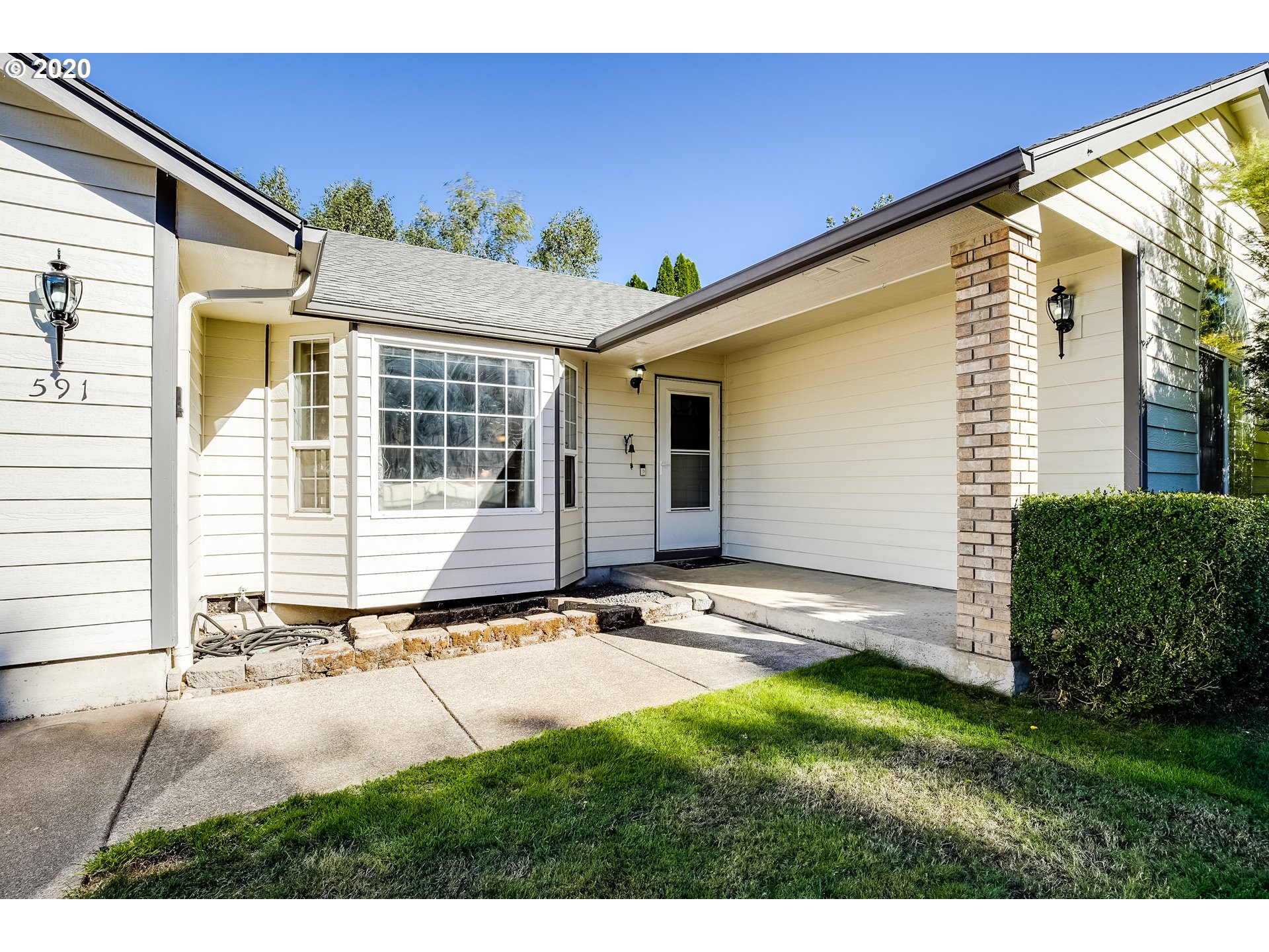 591 68th Place Springfield, OR 97478 - Photo 2 of 31 a view of house with backyard and garden