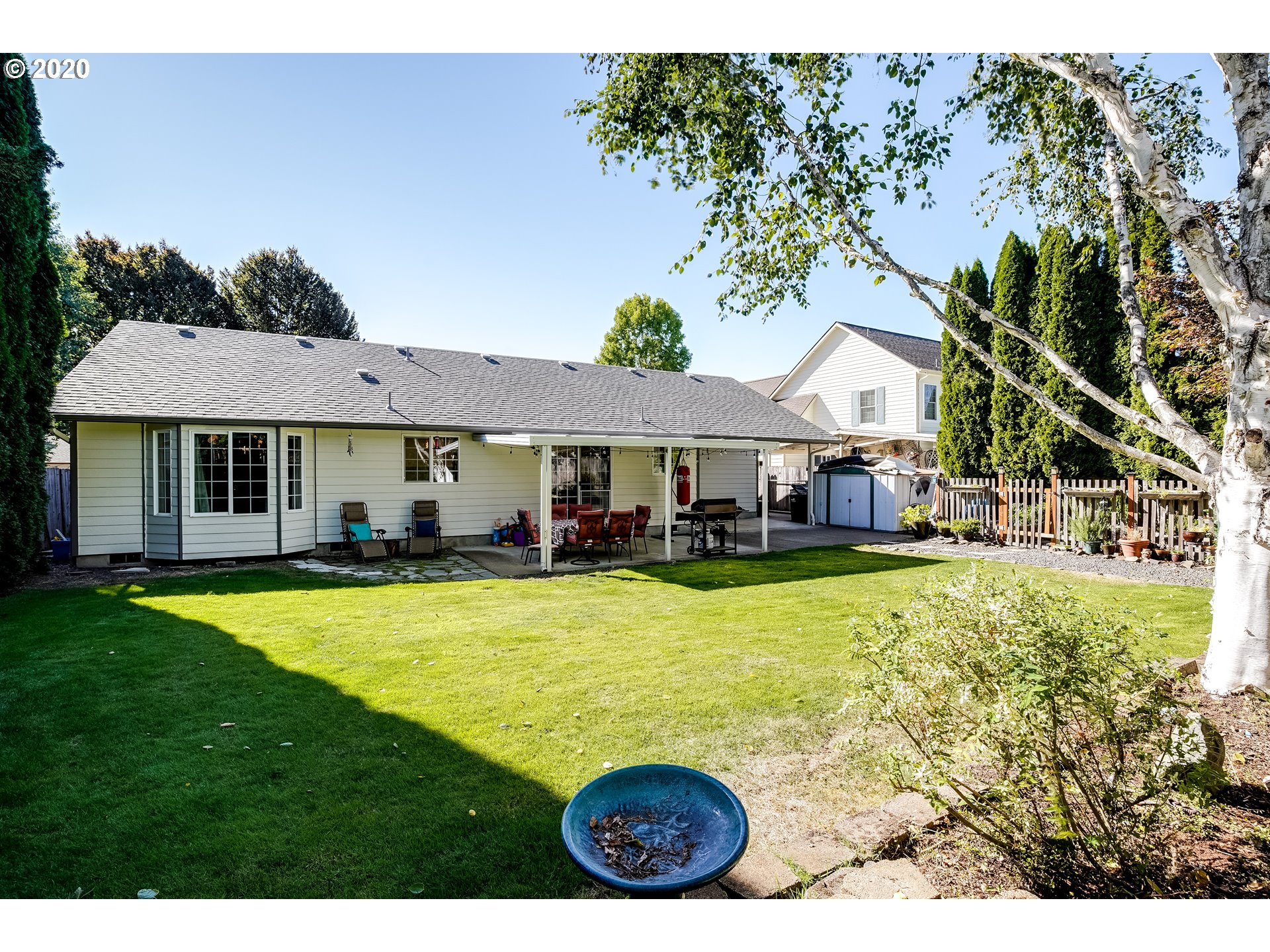 591 68th Place Springfield, OR 97478 - Photo 28 of 31 a view of a house with swimming pool and a yard