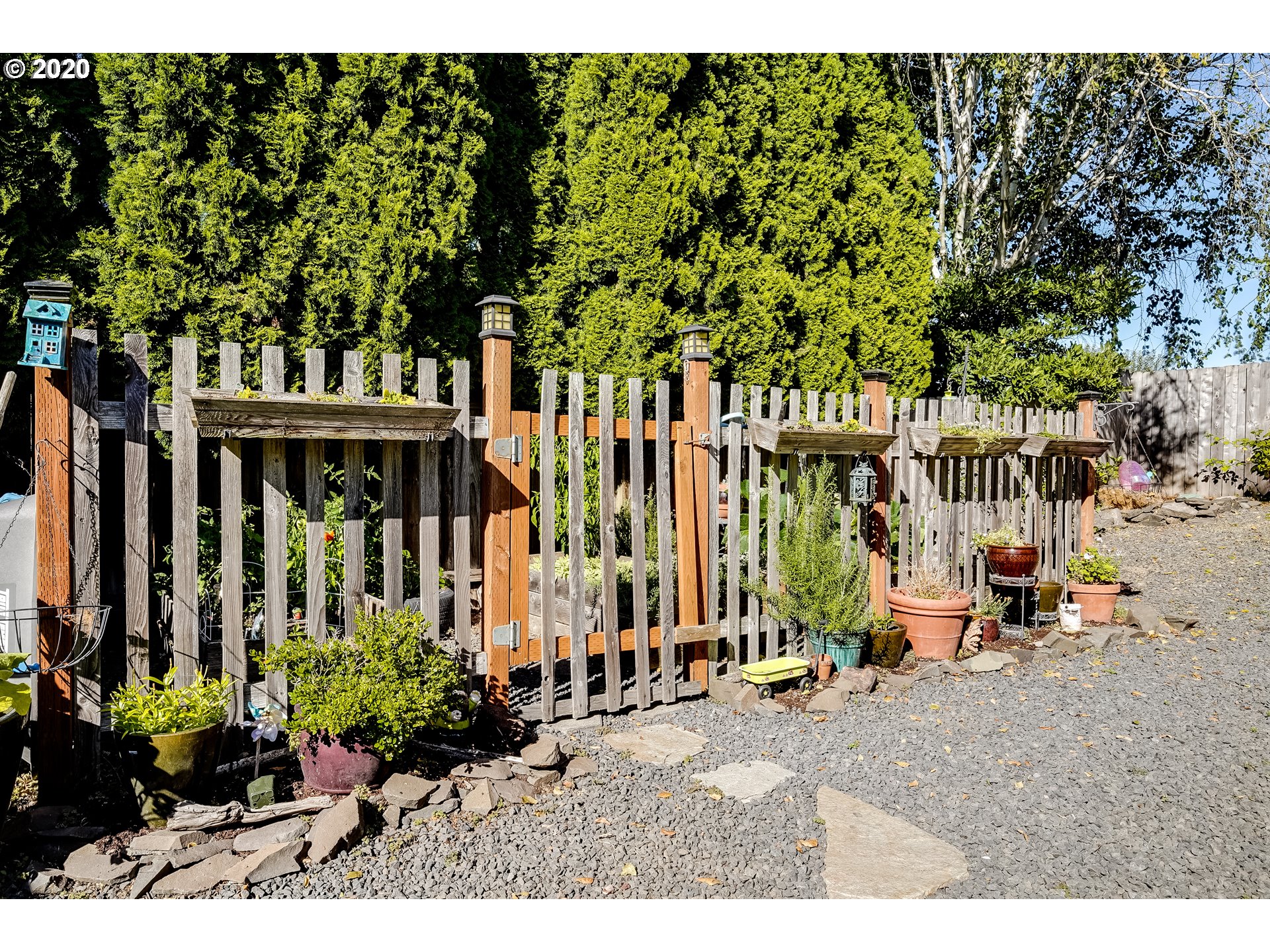 591 68th Place Springfield, OR 97478 - Photo 29 of 31 a backyard of a house with barbeque oven table and chairs