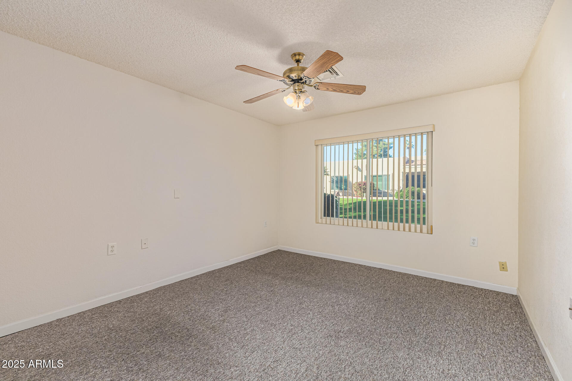 14300 West Bell Road, Unit 440 Surprise, AZ 85374 - Photo 15 of 40 a view of an empty room with a window