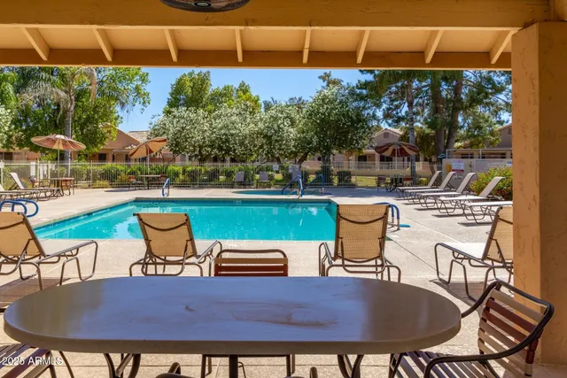 a view of a backyard with sitting area