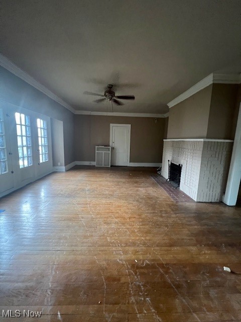 2915 Ludlow Road Cleveland, OH 44120 - Photo 29 of 50 Unfurnished living room with crown molding, a brick fireplace, and ceiling fan