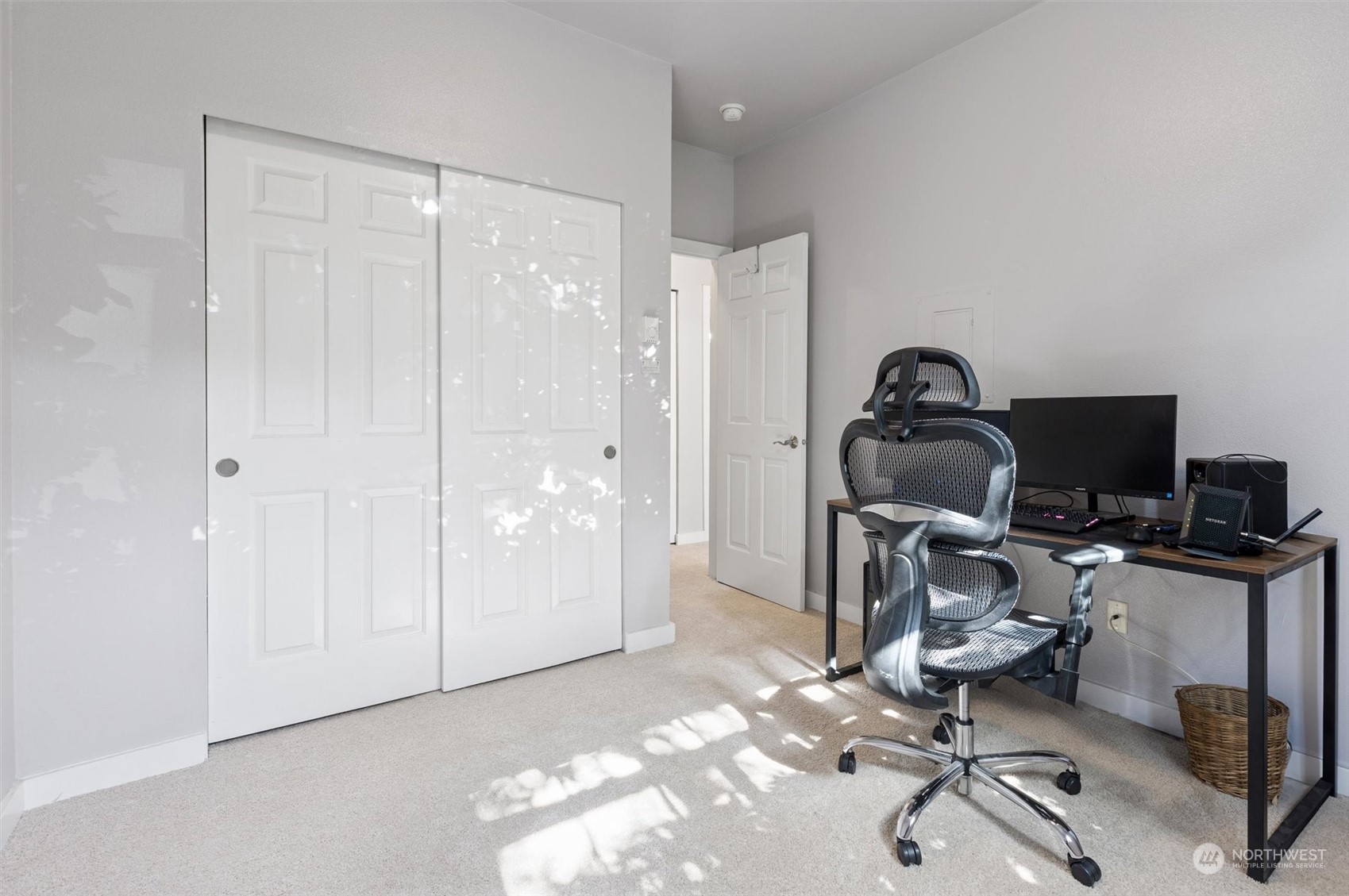 18930 Bothell Everett Highway, Unit C106 Bothell, WA 98012 - Photo 11 of 20 a view of a workspace with furniture and a bathroom