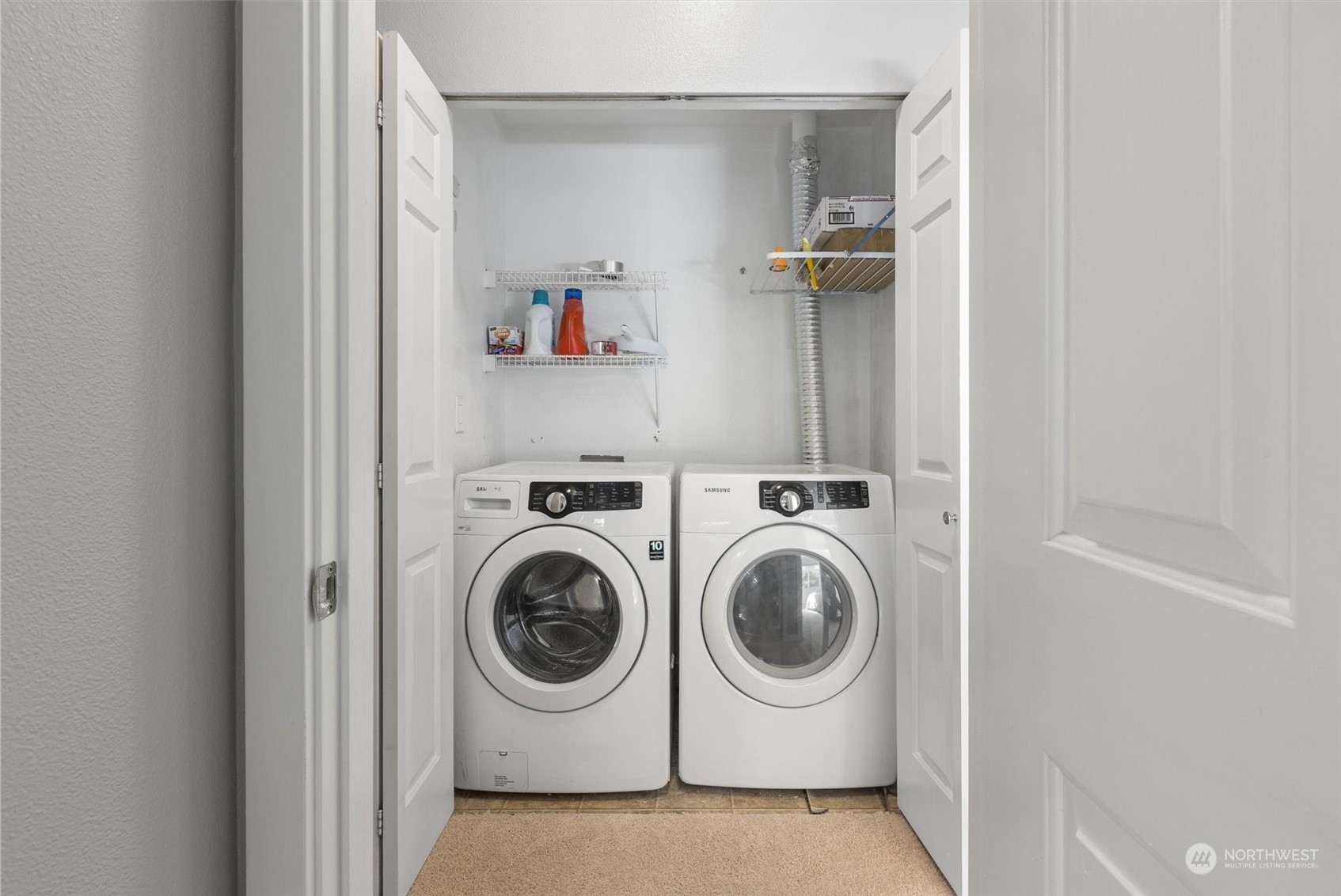 18930 Bothell Everett Highway, Unit C106 Bothell, WA 98012 - Photo 13 of 20 a utility room with dryer and washer
