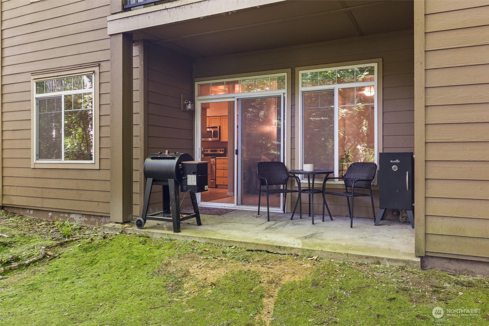 18930 Bothell Everett Highway, Unit C106 Bothell, WA 98012 - Photo 14 of 20 a view of two chairs in the patio