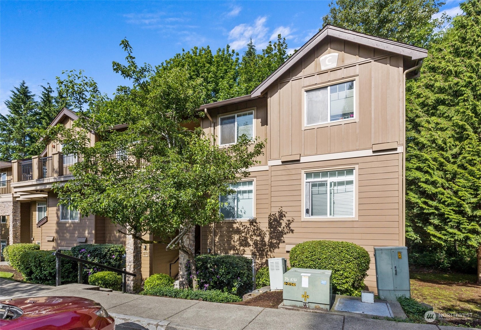 18930 Bothell Everett Highway, Unit C106 Bothell, WA 98012 - Photo 18 of 20 a front view of a house with a yard