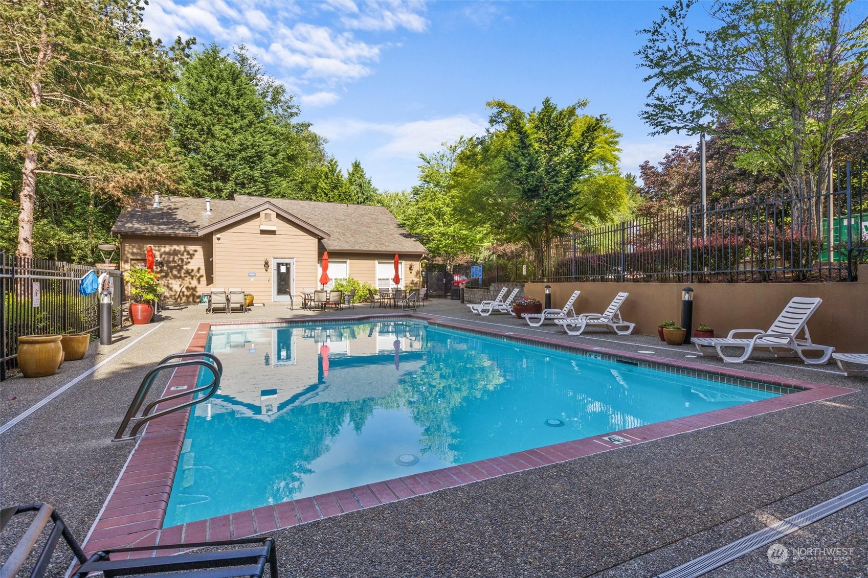 18930 Bothell Everett Highway, Unit C106 Bothell, WA 98012 - Photo 19 of 20 an aerial view of a house with swimming pool and patio