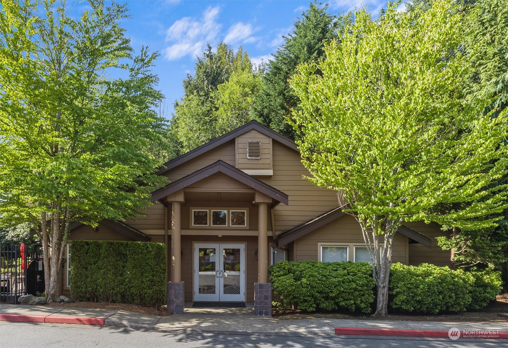 18930 Bothell Everett Highway, Unit C106 Bothell, WA 98012 - Photo 20 of 20 a front view of a house with a yard