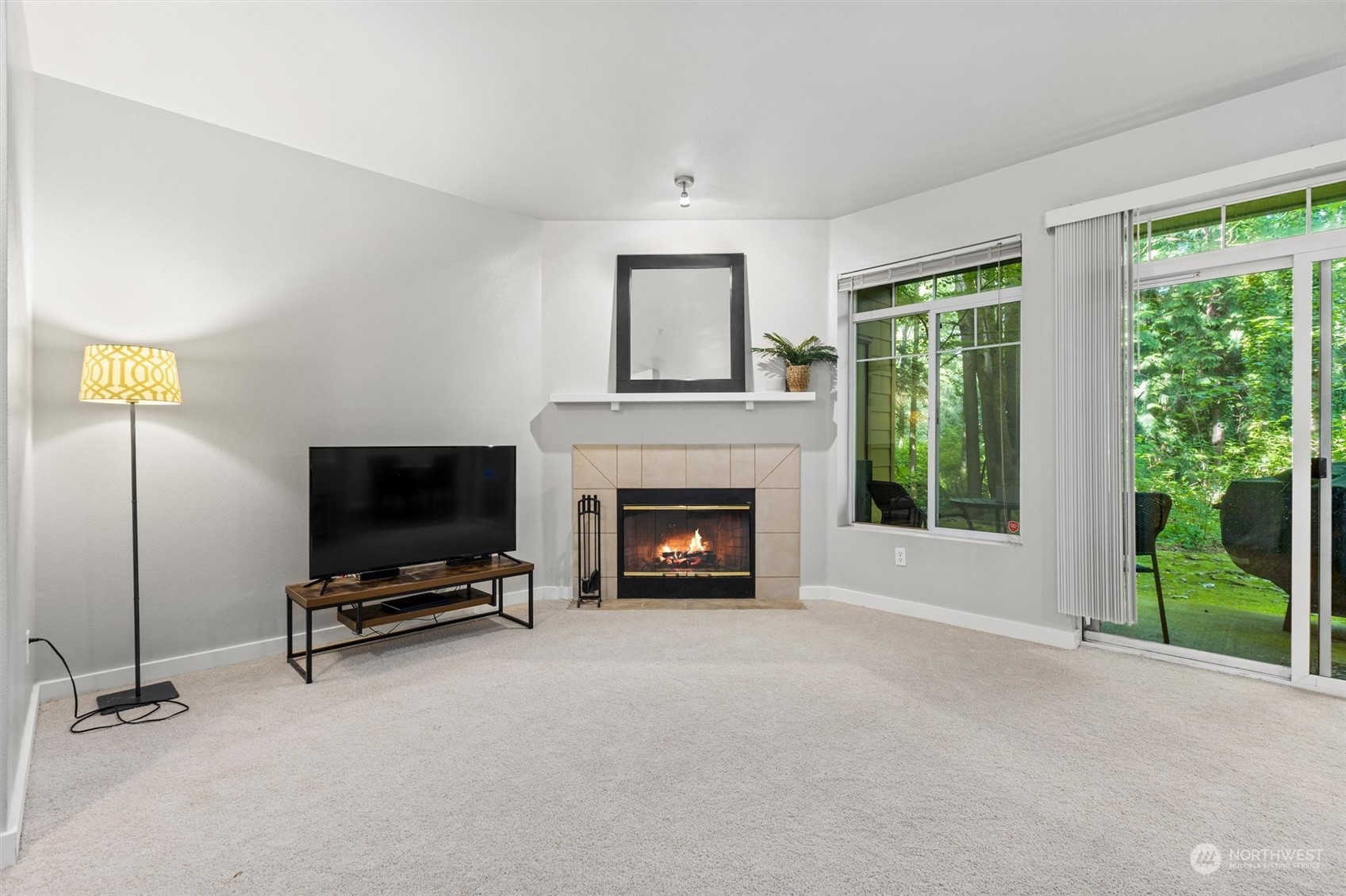 18930 Bothell Everett Highway, Unit C106 Bothell, WA 98012 - Photo 2 of 20 a living room with furniture and a fireplace