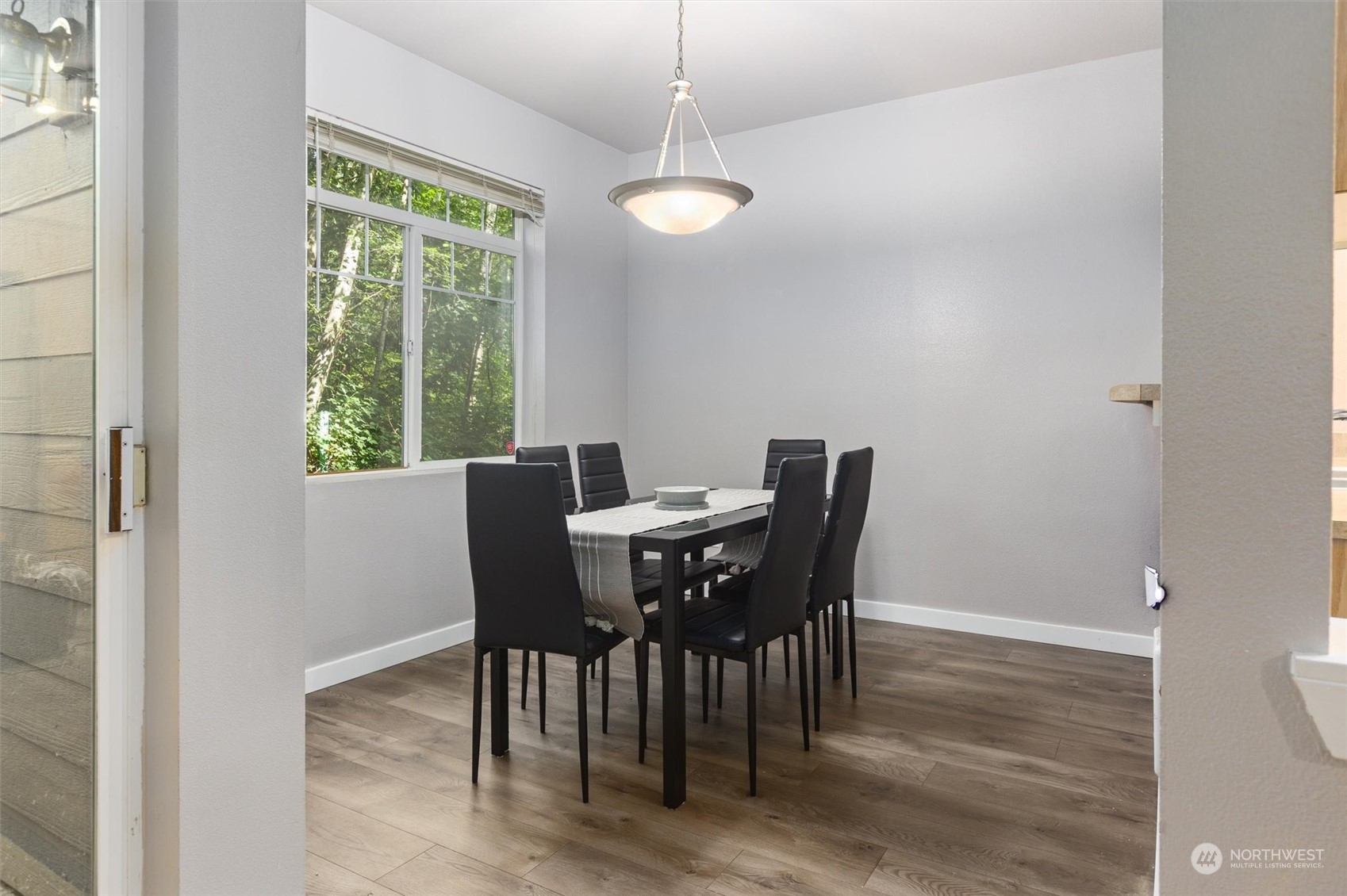 18930 Bothell Everett Highway, Unit C106 Bothell, WA 98012 - Photo 4 of 20 a view of a dining room with furniture window and outside view