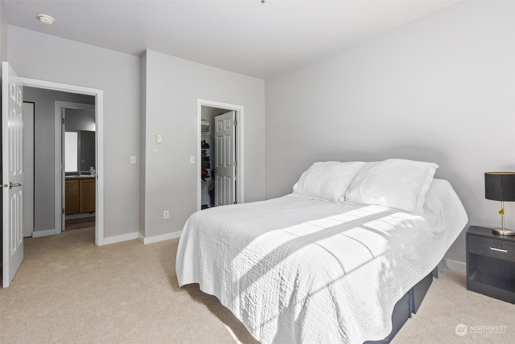 18930 Bothell Everett Highway, Unit C106 Bothell, WA 98012 - Photo 9 of 20 a bedroom with a bed and closet