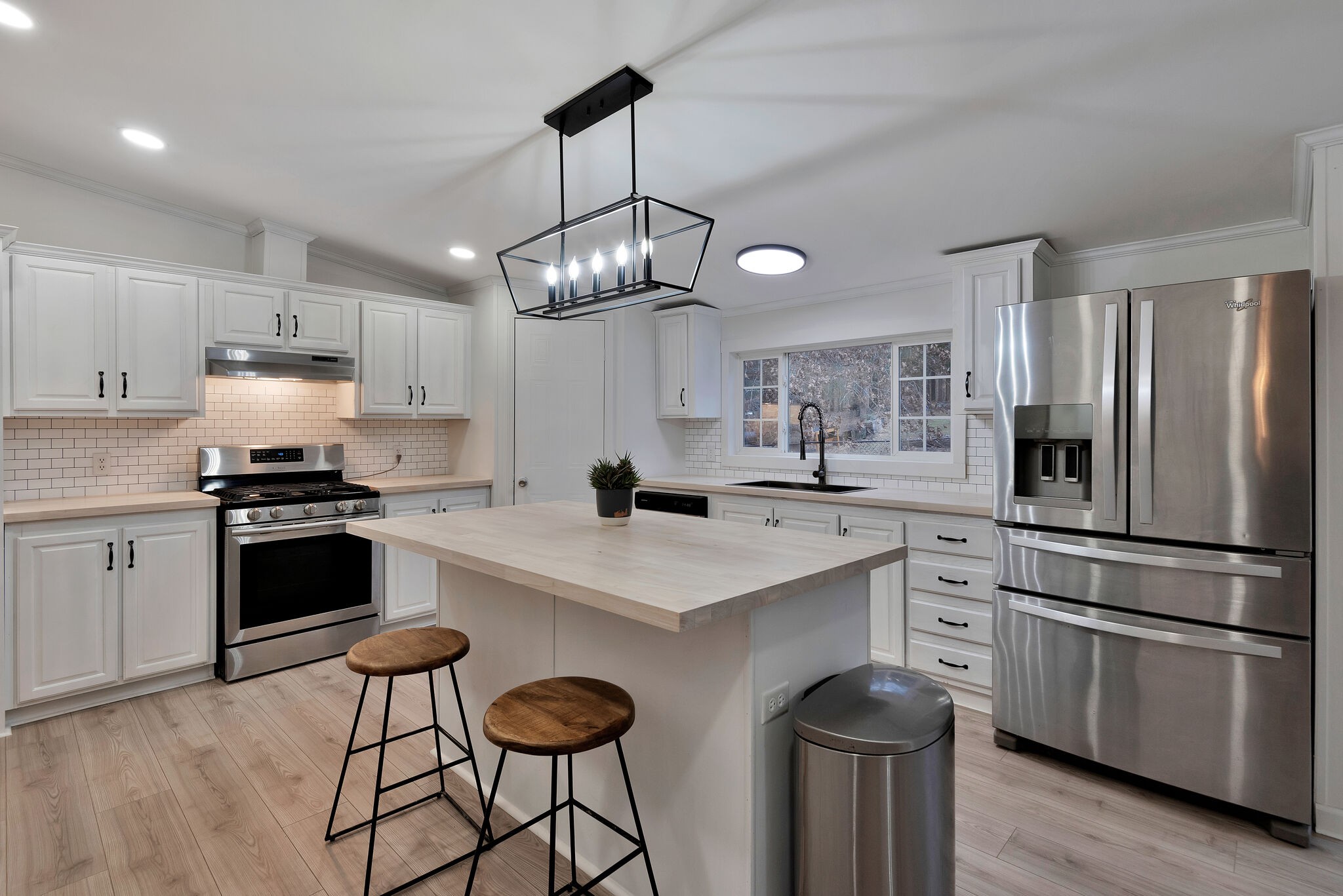 3063 Sweethome Road Chapmansboro, TN 37035 - Photo 11 of 55 a kitchen with kitchen island granite countertop stainless steel appliances cabinets a sink and a counter top space