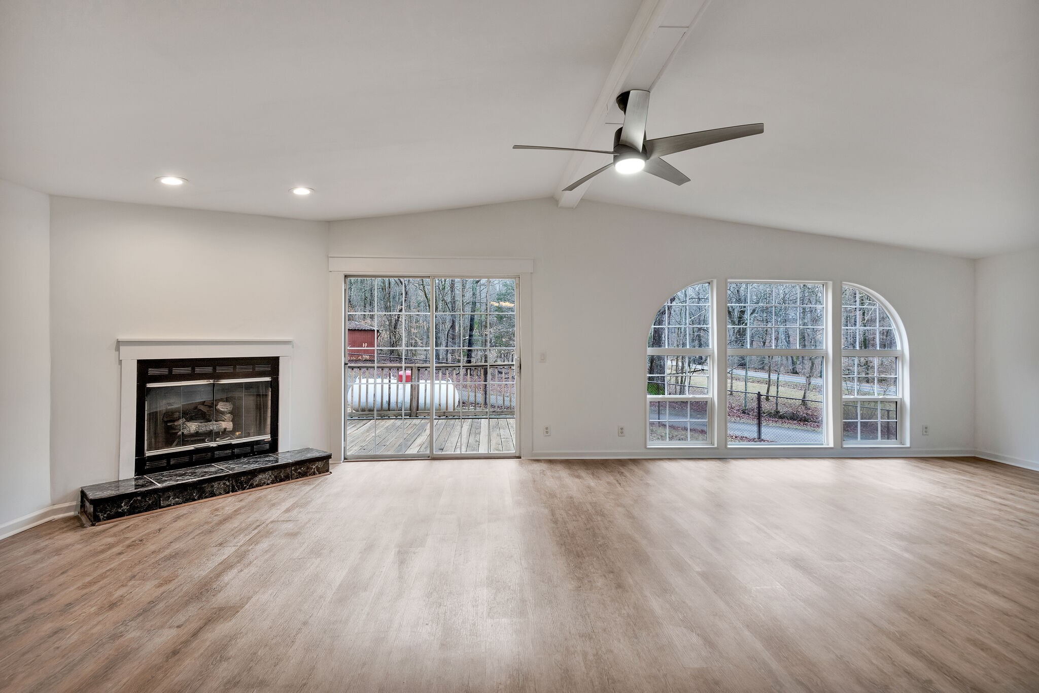 3063 Sweethome Road Chapmansboro, TN 37035 - Photo 15 of 55 a view of wooden floor fire place and windows in a room