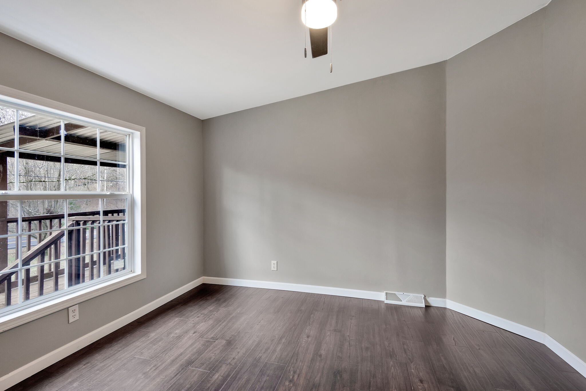 3063 Sweethome Road Chapmansboro, TN 37035 - Photo 22 of 55 an empty room with wooden floor and windows