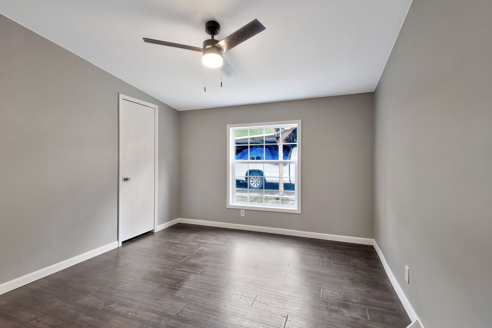 3063 Sweethome Road Chapmansboro, TN 37035 - Photo 25 of 55 an empty room with wooden floor and windows