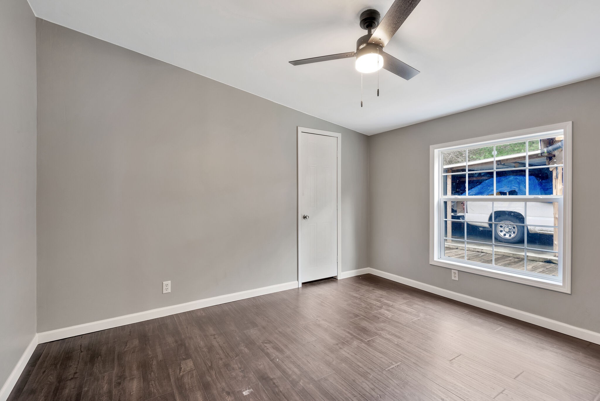 3063 Sweethome Road Chapmansboro, TN 37035 - Photo 26 of 55 a view of an empty room with a window and wooden floor