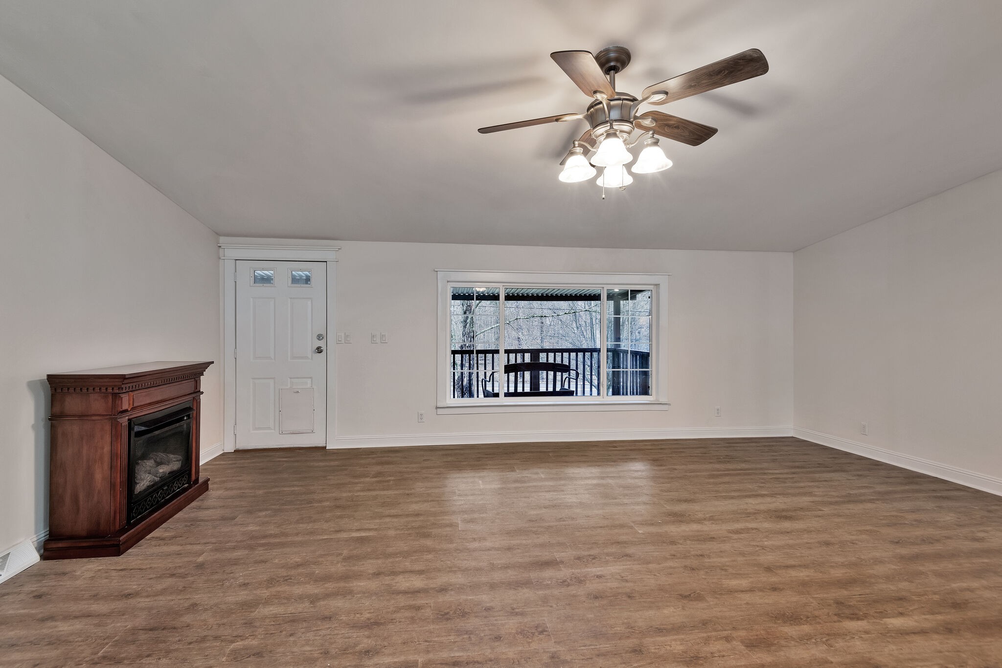 3063 Sweethome Road Chapmansboro, TN 37035 - Photo 5 of 55 a view of an empty room with a window and fireplace