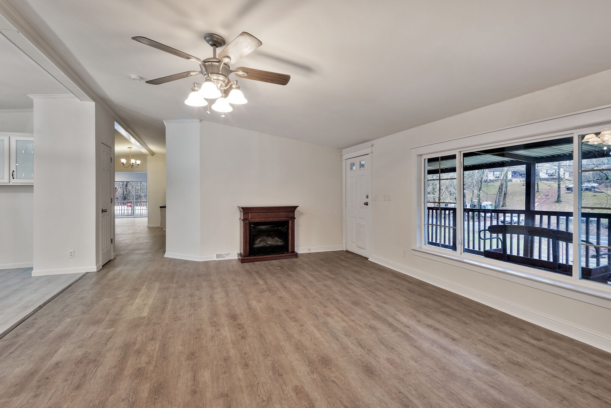 3063 Sweethome Road Chapmansboro, TN 37035 - Photo 6 of 55 a view of an empty room with a window and wooden floor