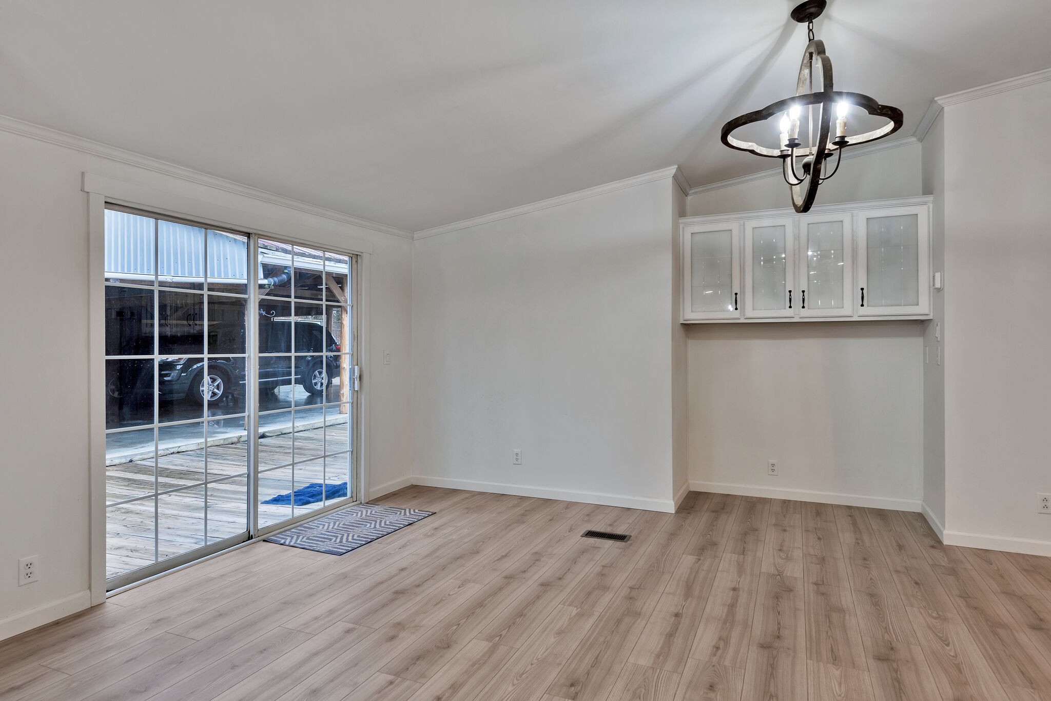 3063 Sweethome Road Chapmansboro, TN 37035 - Photo 8 of 55 a view of a room with wooden floor empty shelves and windows