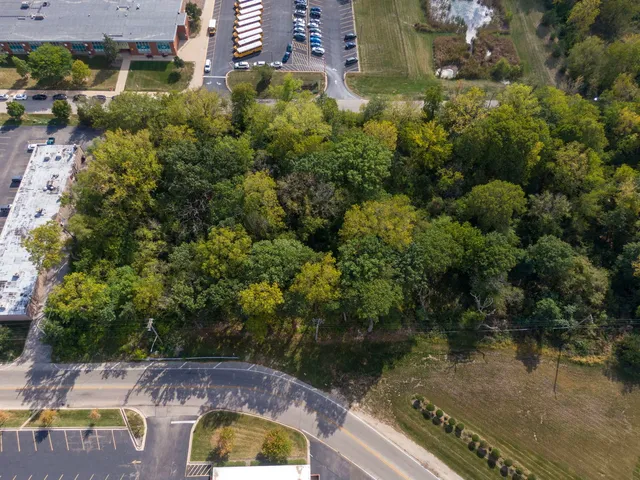 an aerial view of a house with a lake view