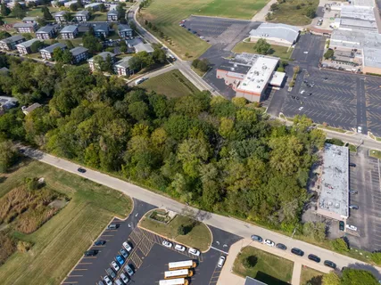 an aerial view of a house with a yard