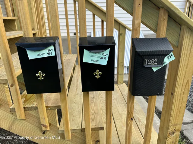 a front view of a house with large windows